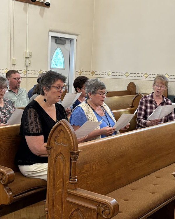 Members seated in the wooden pews during worship