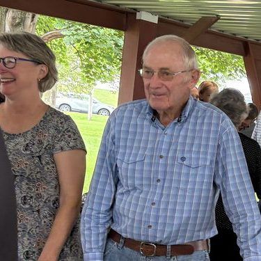 Neighbors chatting at the fellowship meal