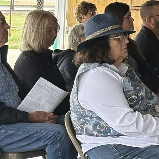 Congregation seated together at an outdoor service