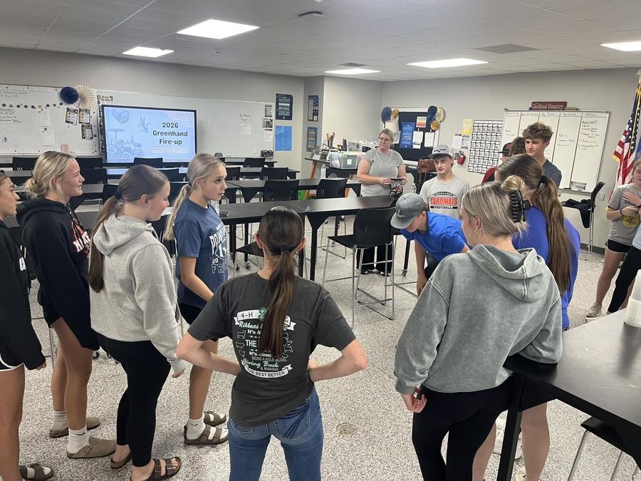 Members taking part in team-building games in a classroom during Greenhand Fire-Up.